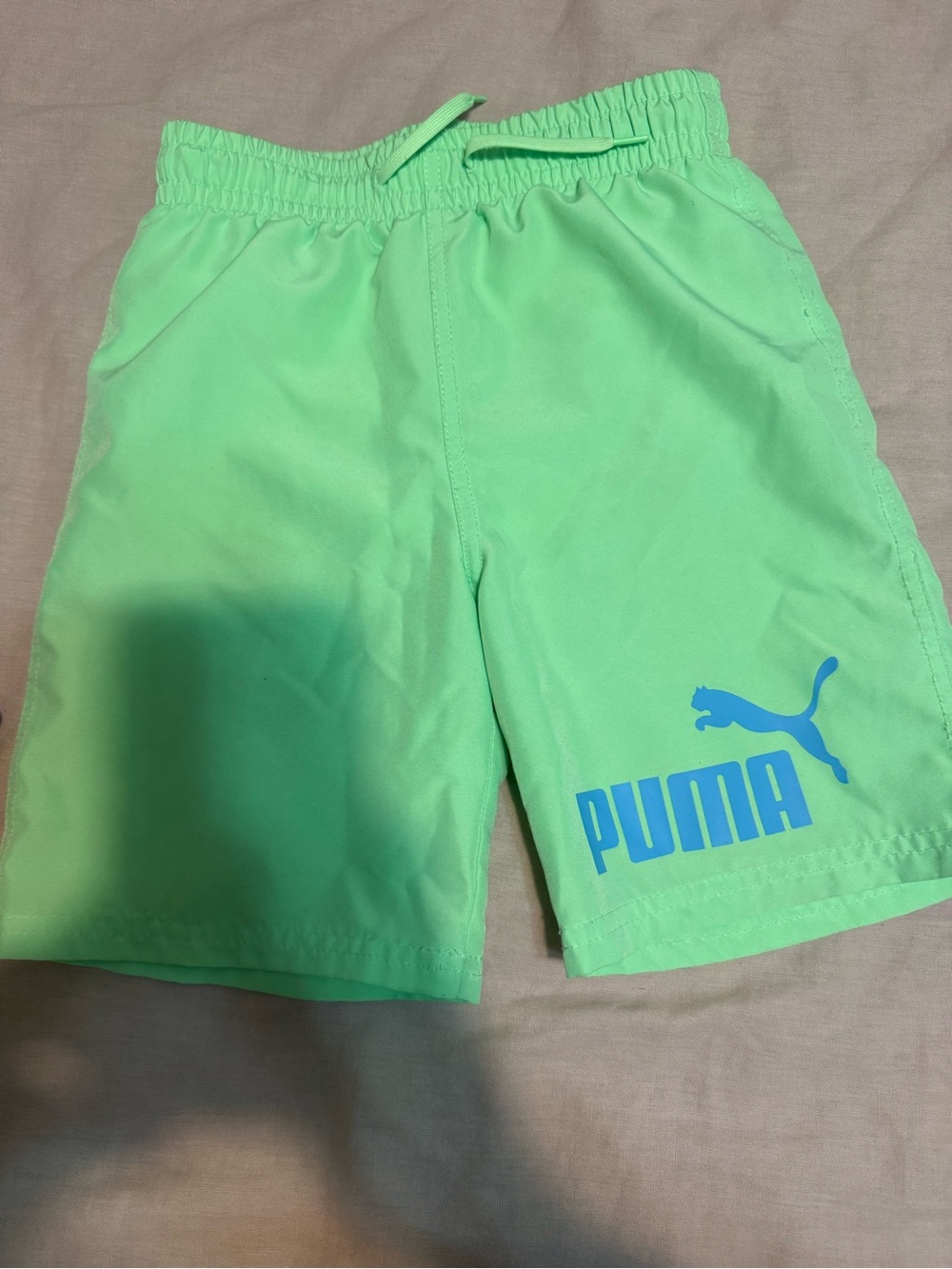 Boys Swim trunks Puma Neon green with Blue Logo. Size 7